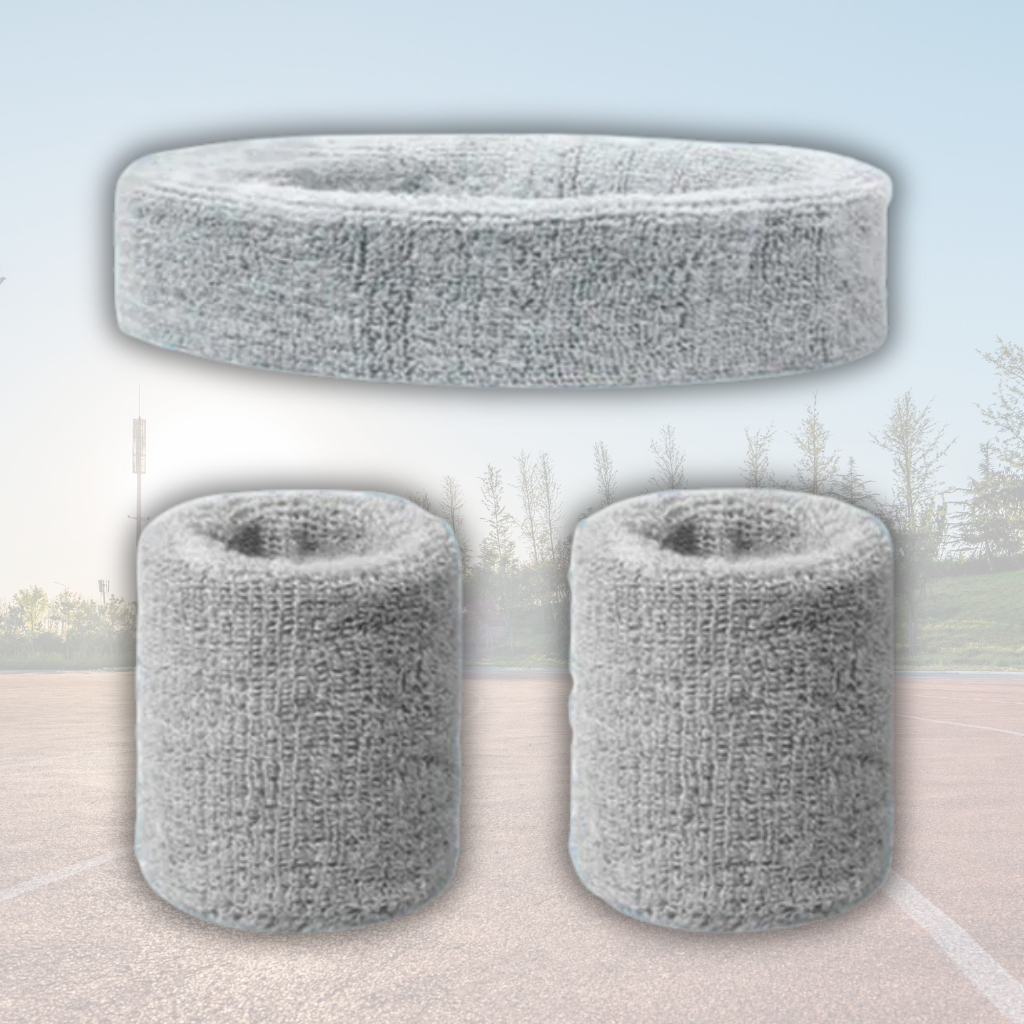 A Sportiq DripFlex Headband Set in Gray Steel, made from a polyester cotton blend with medium to high level elasticity and machine washable (cold), displayed on a grass background.