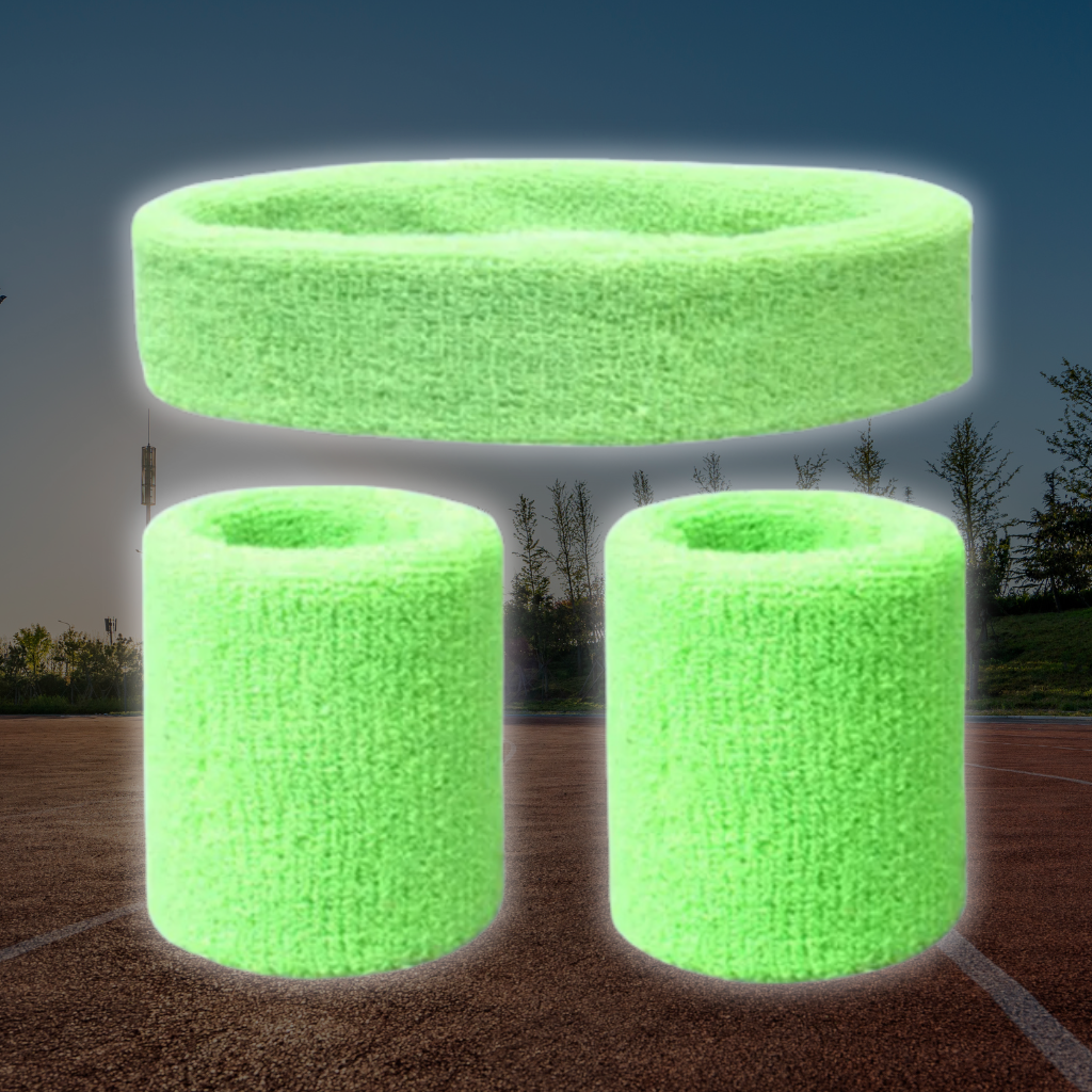A Sportiq DripFlex Headband Set in Mint Lime Green, made from a polyester cotton blend with medium to high level elasticity and machine washable (cold), displayed on a grass background.