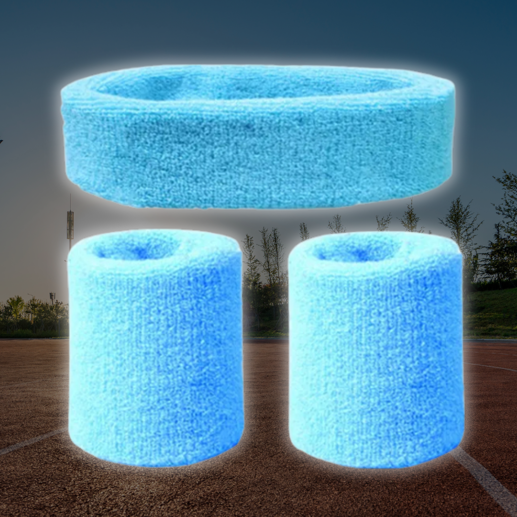A Sportiq DripFlex Headband Set in Sky Blue, made from a polyester cotton blend with medium to high level elasticity and machine washable (cold), displayed on a grass background.