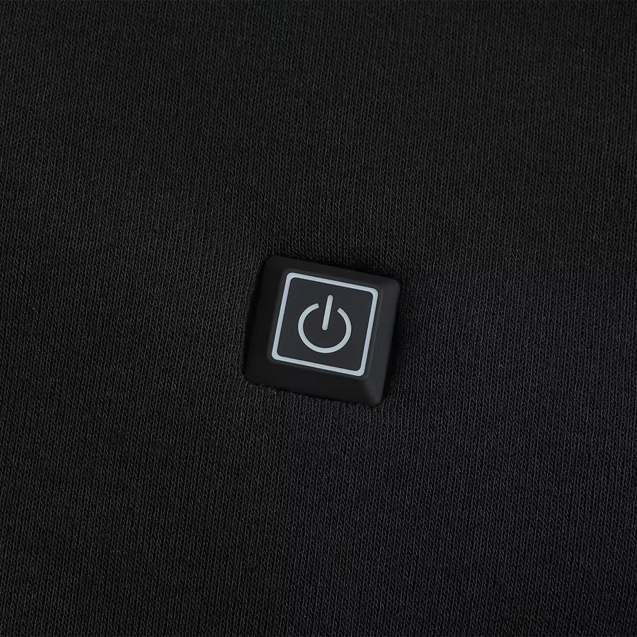 Showcase of the heat control button for a Black Sportiq HeatCore Hoodie, weatherproof with insulation and electric heated carbon fibre panels.