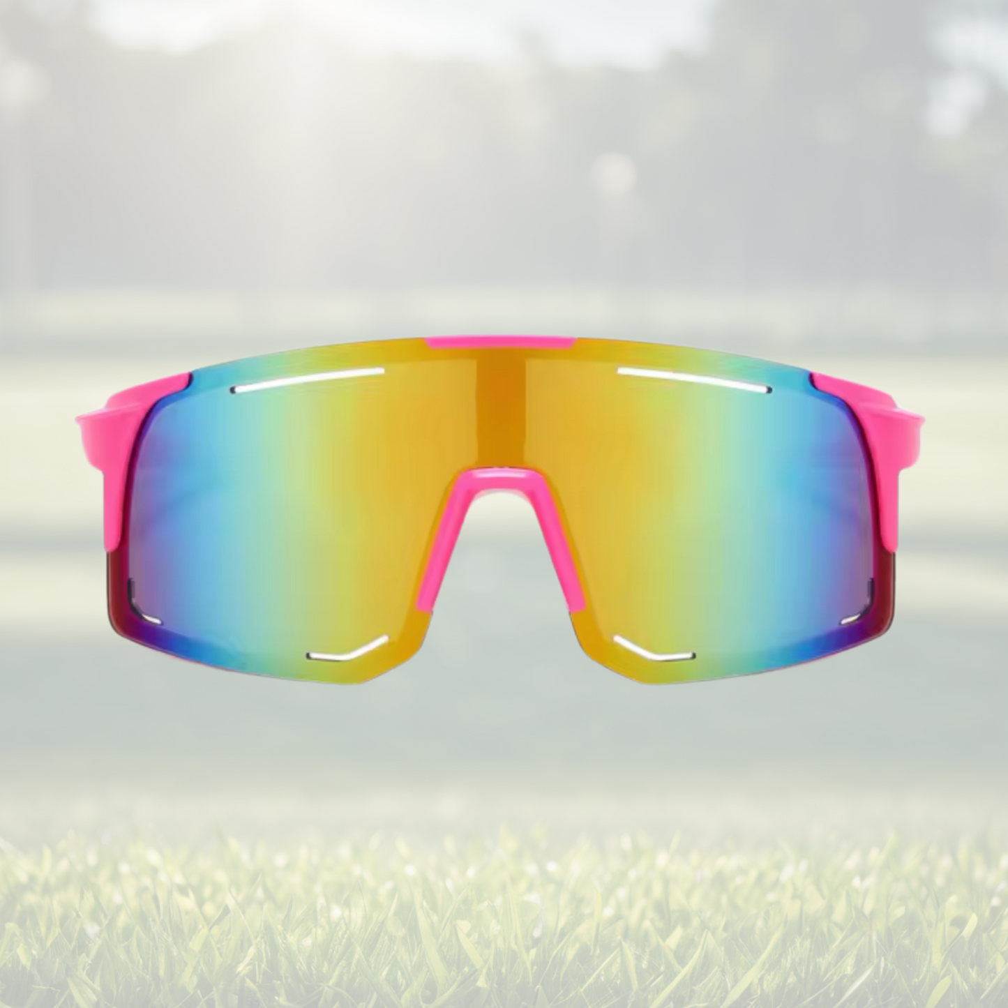 A pair of Sportiq Horizon Neon performance sunglasses with multicoloured reflective lenses and pink frame, UV400, polycarbonate frame with polycarbonate lens, displayed on a grass background.