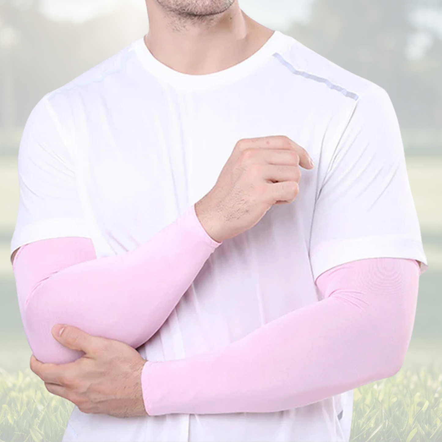 A pair of Sportiq Swift Sleeves in BlushCharge Pink, flexible and stretchy made of breathable polyester with a cooling and sun blocking affect, displayed on a grass background.