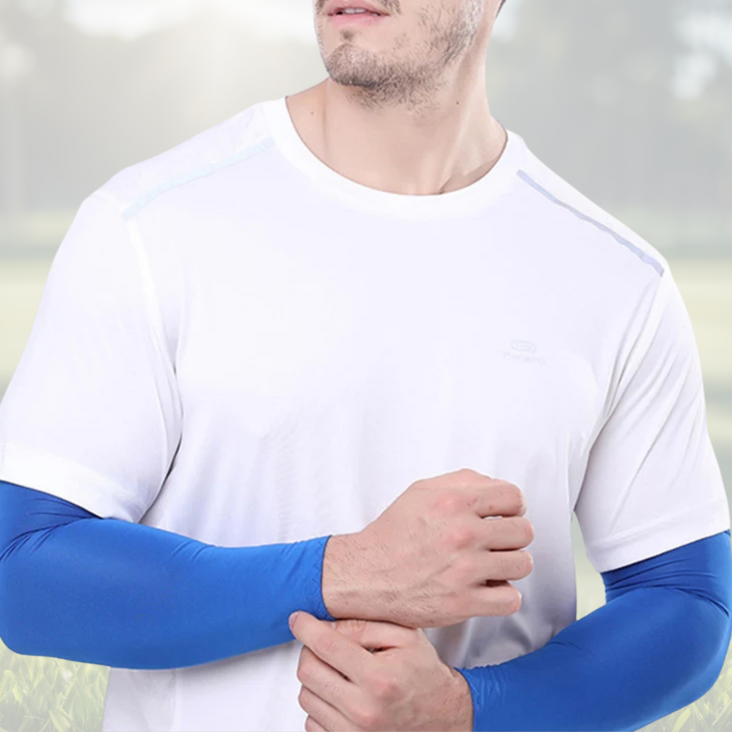 A pair of Sportiq Swift Sleeves in Deep Surf Blue, flexible and stretchy made of breathable polyester with a cooling and sun blocking affect, displayed on a grass background.