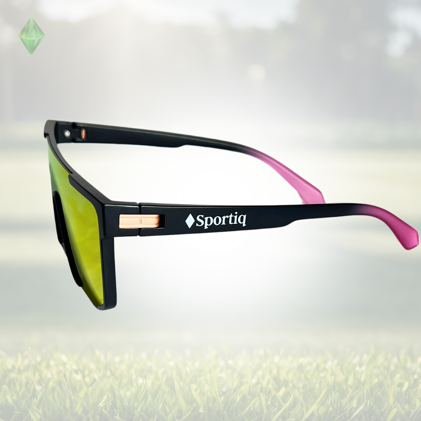 A pair of Sportiq Zen - Pink professional sport sunglasses with pink reflective lenses and black frame, polarized UV400, polycarbonate frame with TAC lens, displayed on a grass background.