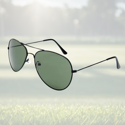 A pair of Sportiq Altitude Nightfall performance sunglasses with black lenses and steel frame, UV400, polycarbonate frame with polycarbonate lens, displayed on a grass background.