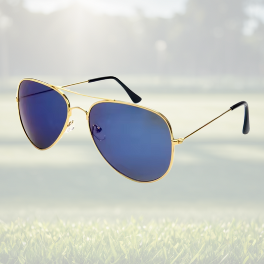 A pair of Sportiq Altitude Royal performance sunglasses with blue lenses and steel frame, UV400 rate with a polycarbonate lens, displayed on a grass background.