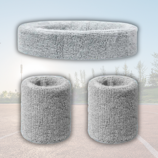 A Sportiq DripFlex Headband Set in Gray Steel, made from a polyester cotton blend with medium to high level elasticity and machine washable (cold), displayed on a grass background.