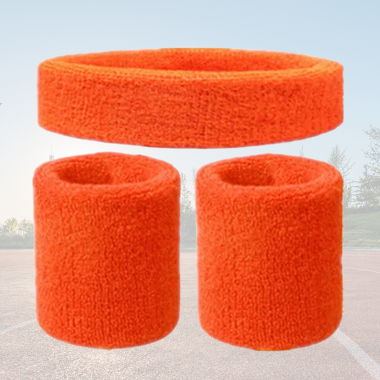 A Sportiq DripFlex Headband Set in Mandarin Orange, made from a polyester cotton blend with medium to high level elasticity and machine washable (cold), displayed on a grass background.