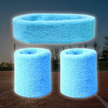 A Sportiq DripFlex Headband Set in Sky Blue, made from a polyester cotton blend with medium to high level elasticity and machine washable (cold), displayed on a grass background.