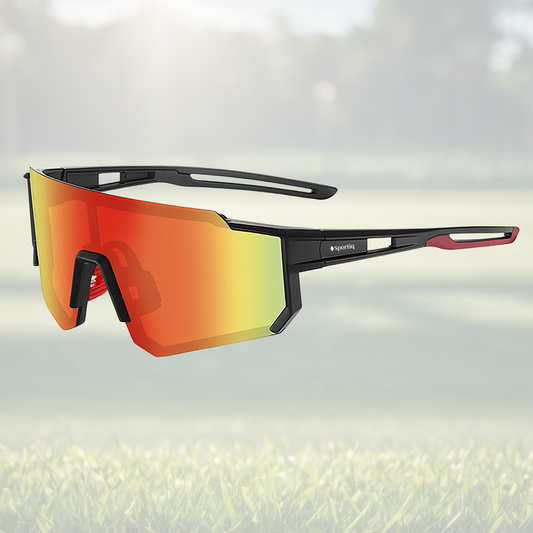 A pair of Sportiq Gamechanger Ember professional sport sunglasses with red reflective lenses and black frame, polarized UV400, polycarbonate frame with TAC lens, displayed on a grass background.