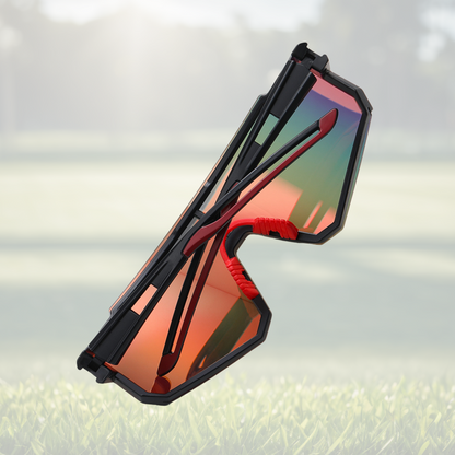 A pair of Sportiq Gamechanger Ember professional sport sunglasses with red reflective lenses and black frame, polarized UV400, polycarbonate frame with TAC lens, displayed on a grass background.
