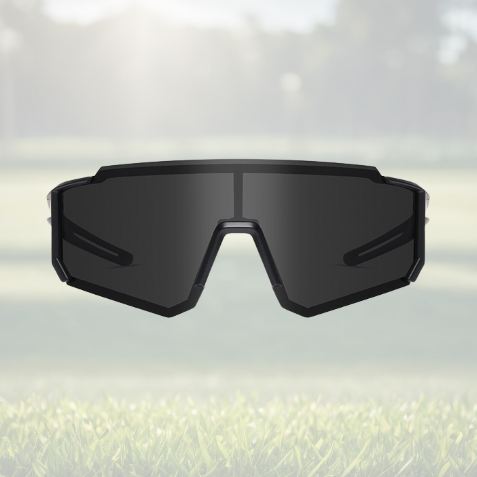 A pair of Sportiq Gamechanger Stealth professional sport sunglasses with black lenses and black frame, polarized UV400, polycarbonate frame with TAC lens, displayed on a grass background.