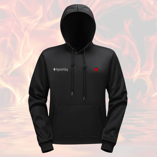 A Black Sportiq HeatCore Hoodie, weatherproof with insulation and electric heated carbon fibre panels. Displayed on a flames background to showcase the heating ability.