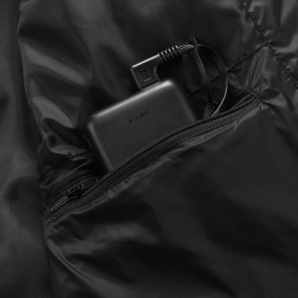Showcase of battery storage pocket for a Black Sportiq HeatCore Jacket, weatherproof with insulation and electric heated carbon fibre panels. 