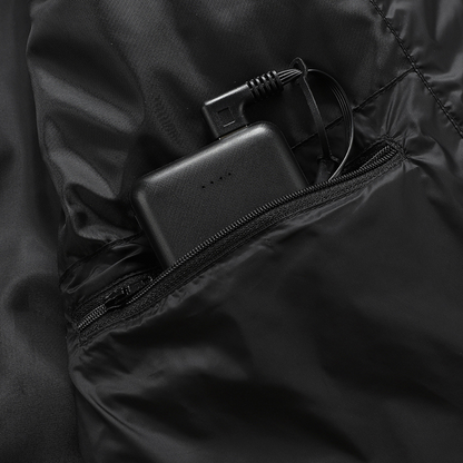 Showcase of battery storage pocket for a Black Sportiq HeatCore Jacket, weatherproof with insulation and electric heated carbon fibre panels. 