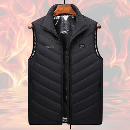 A Black Sportiq HeatCore Vest, puffer style and weatherproof, wind resistant with electric heated carbon fibre panels. Displayed on a flames background to showcase the heating ability.
