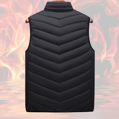 A Black Sportiq HeatCore Vest, puffer style and weatherproof, wind resistant with electric heated carbon fibre panels. Displayed on a flames background to showcase the heating ability.