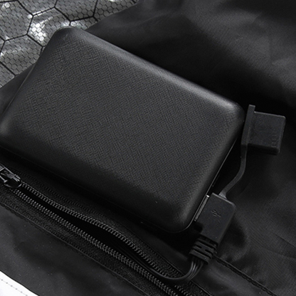 Showcase of battery connector for a Black Sportiq HeatCore Vest, puffer style and weatherproof, wind resistant with electric heated carbon fibre panels. 