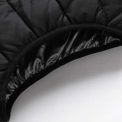 Showcase of the neck and insulation for a Black Sportiq HeatCore Vest, puffer style and weatherproof, wind resistant with electric heated carbon fibre panels. 