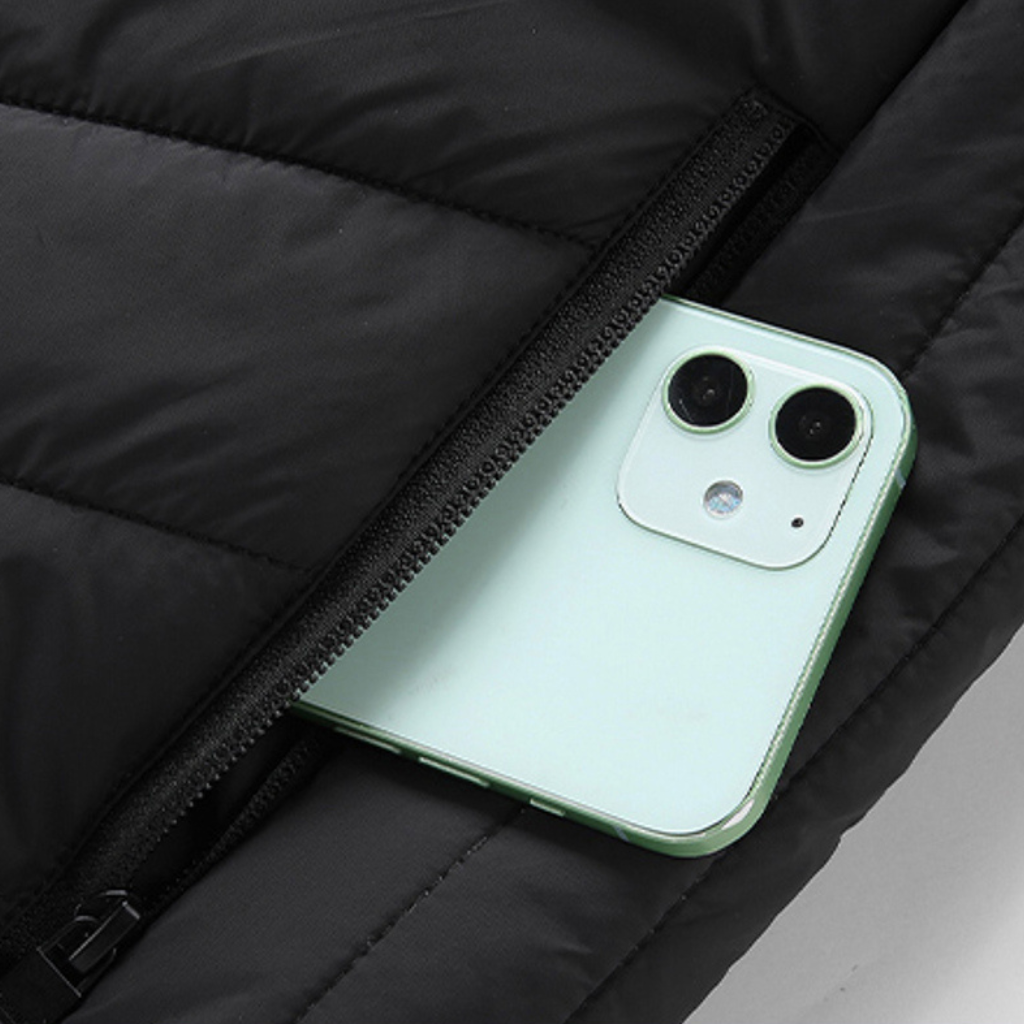 Showcase of a zone control button for a Black Sportiq HeatCore Vest, puffer style and weatherproof, wind resistant with electric heated carbon fibre panels. 