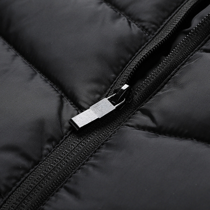 Showcase of the zip for a Black Sportiq HeatCore Vest, puffer style and weatherproof, wind resistant with electric heated carbon fibre panels. 