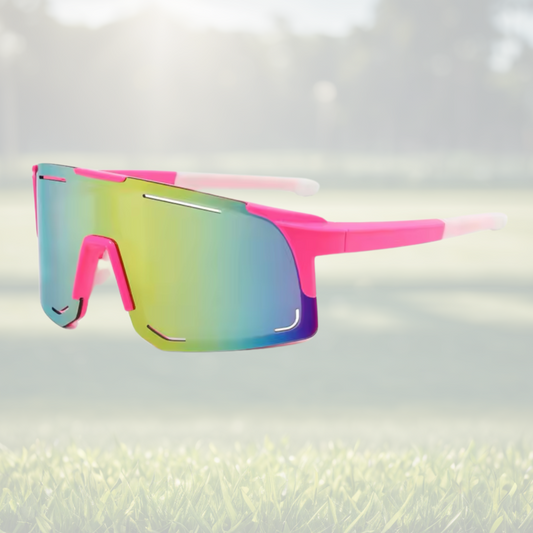 A pair of Sportiq Horizon Neon performance sunglasses with multicoloured reflective lenses and pink frame, UV400, polycarbonate frame with polycarbonate lens, displayed on a grass background.