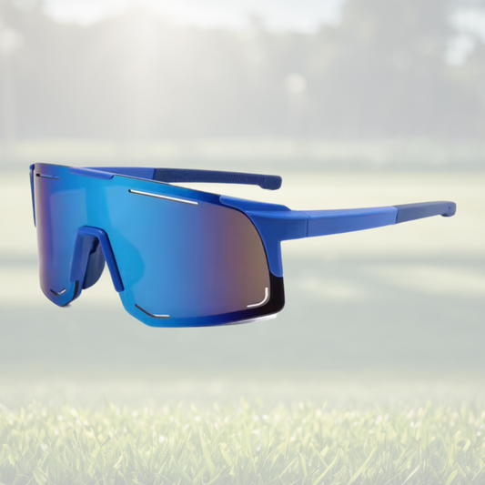 A pair of Sportiq Horizon Tidal performance sunglasses with blue reflective lenses and blue frame, UV400, polycarbonate frame with polycarbonate lens, displayed on a grass background.