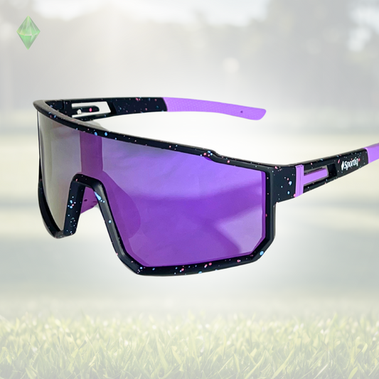 A pair of Sportiq VividShield sunglasses with a purple reflective lens and black frame,  polarized UV400, polycarbonate frame with TAC lens, displayed on a grass background.