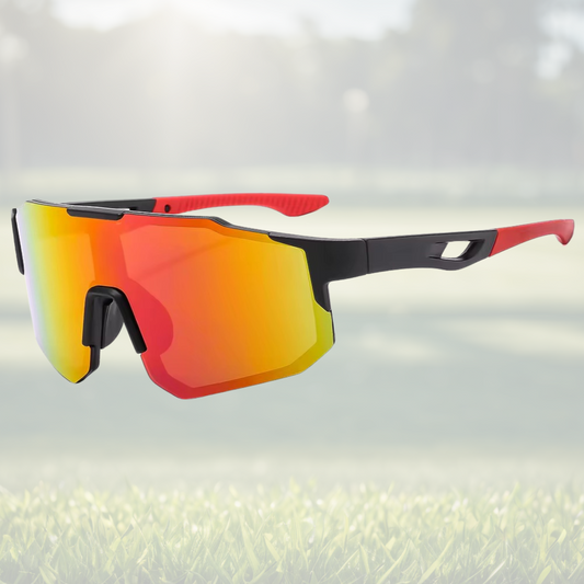 A pair of Sportiq Nimbus Flare performance sunglasses with red reflective lenses and black frame, UV400, polycarbonate frame with polycarbonate lens, displayed on a grass background.