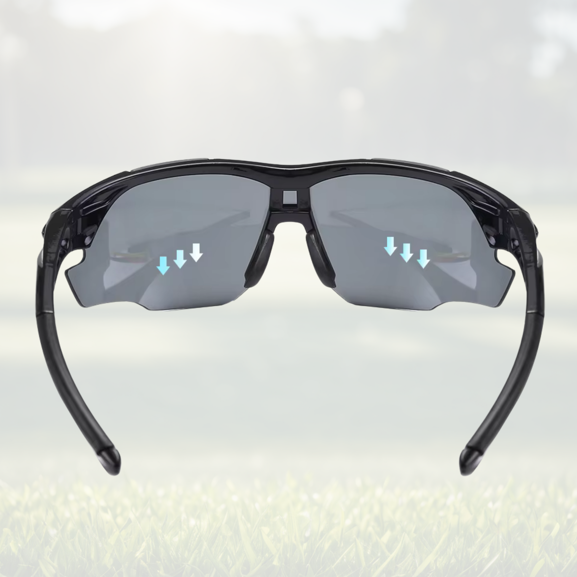 A pair of Sportiq OptiView - Crimson Glow professional sport sunglasses with red reflective lenses and black frame, polarized UV400, polycarbonate frame with TAC lens, displayed on a grass background.