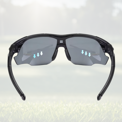 A pair of Sportiq OptiView - Crimson Glow professional sport sunglasses with red reflective lenses and black frame, polarized UV400, polycarbonate frame with TAC lens, displayed on a grass background.