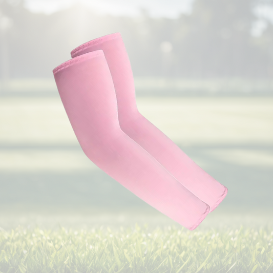 A pair of Sportiq Swift Sleeves in BlushCharge Pink, flexible and stretchy made of breathable polyester with a cooling and sun blocking affect, displayed on a grass background.