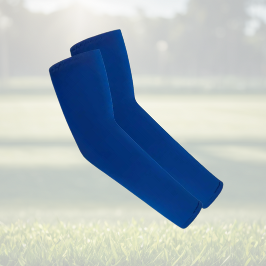 A pair of Sportiq Swift Sleeves in Deep Surf Blue, flexible and stretchy made of breathable polyester with a cooling and sun blocking affect, displayed on a grass background.