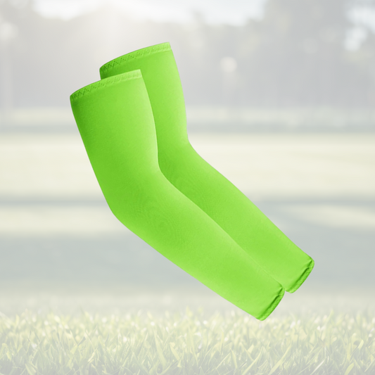 A pair of Sportiq Swift Sleeves in Neon Volt Lime Green, flexible and stretchy made of breathable polyester with a cooling and sun blocking affect, displayed on a grass background.