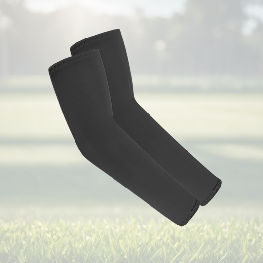 A pair of Sportiq Swift Sleeves in Stealthcore Black, flexible and stretchy made of breathable polyester with a cooling and sun blocking affect, displayed on a grass background.