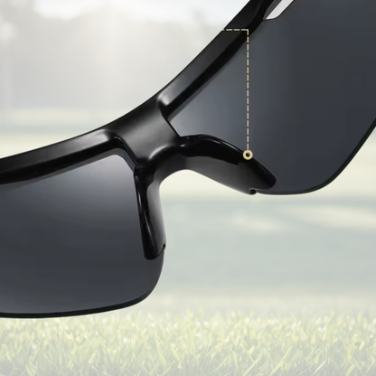 A pair of Sportiq Vector Tempest performance sunglasses with reflective blue lenses and black frame, UV400, polycarbonate frame with polycarbonate lens, displayed on a grass background.