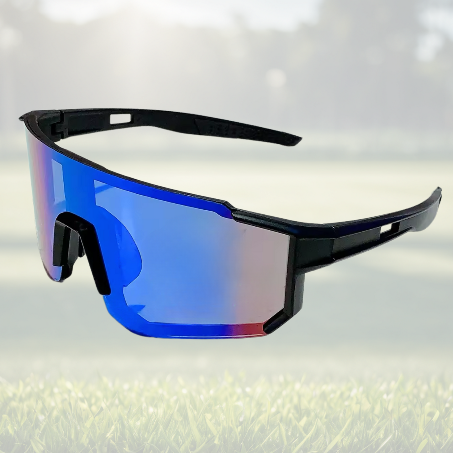 A pair of Sportiq Velocity Aurora performance sunglasses with blue reflective lenses and black frame, UV400, polycarbonate frame with polycarbonate lens, displayed on a grass background.