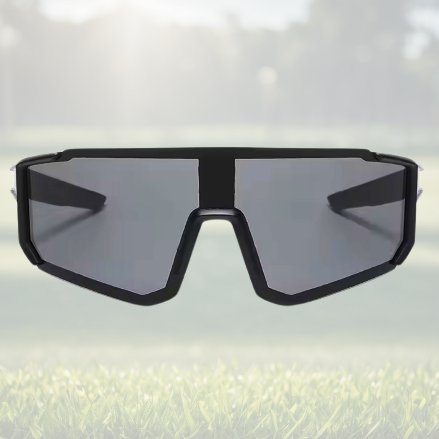 A pair of Sportiq Velocity Aurora performance sunglasses with blue reflective lenses and black frame, UV400, polycarbonate frame with polycarbonate lens, displayed on a grass background.